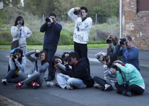 Who's behind the camera? Course students capture the perfect shot of a model jumping mid-air.