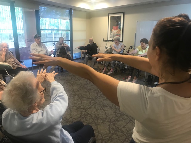 Lalen teaching yoga to the elderly